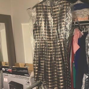 A beautiful never even taken the tags off gold and black from office to dinner.